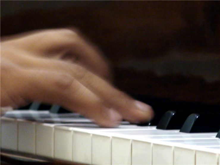 Hand on the Piano Keys