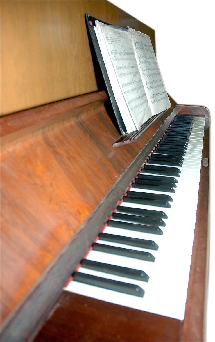 Old Piano with Sheet Music Notes